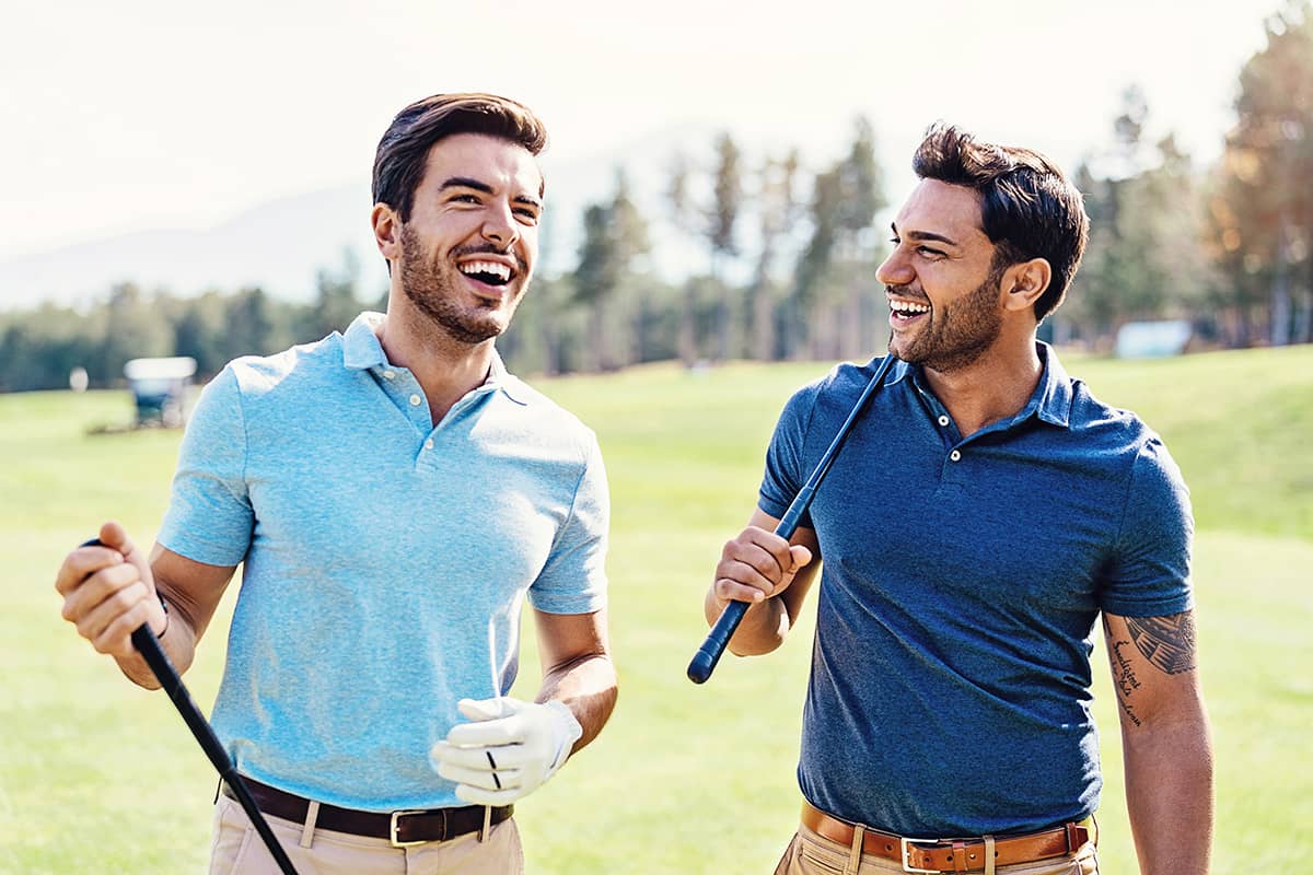 Two people laughing on golf course