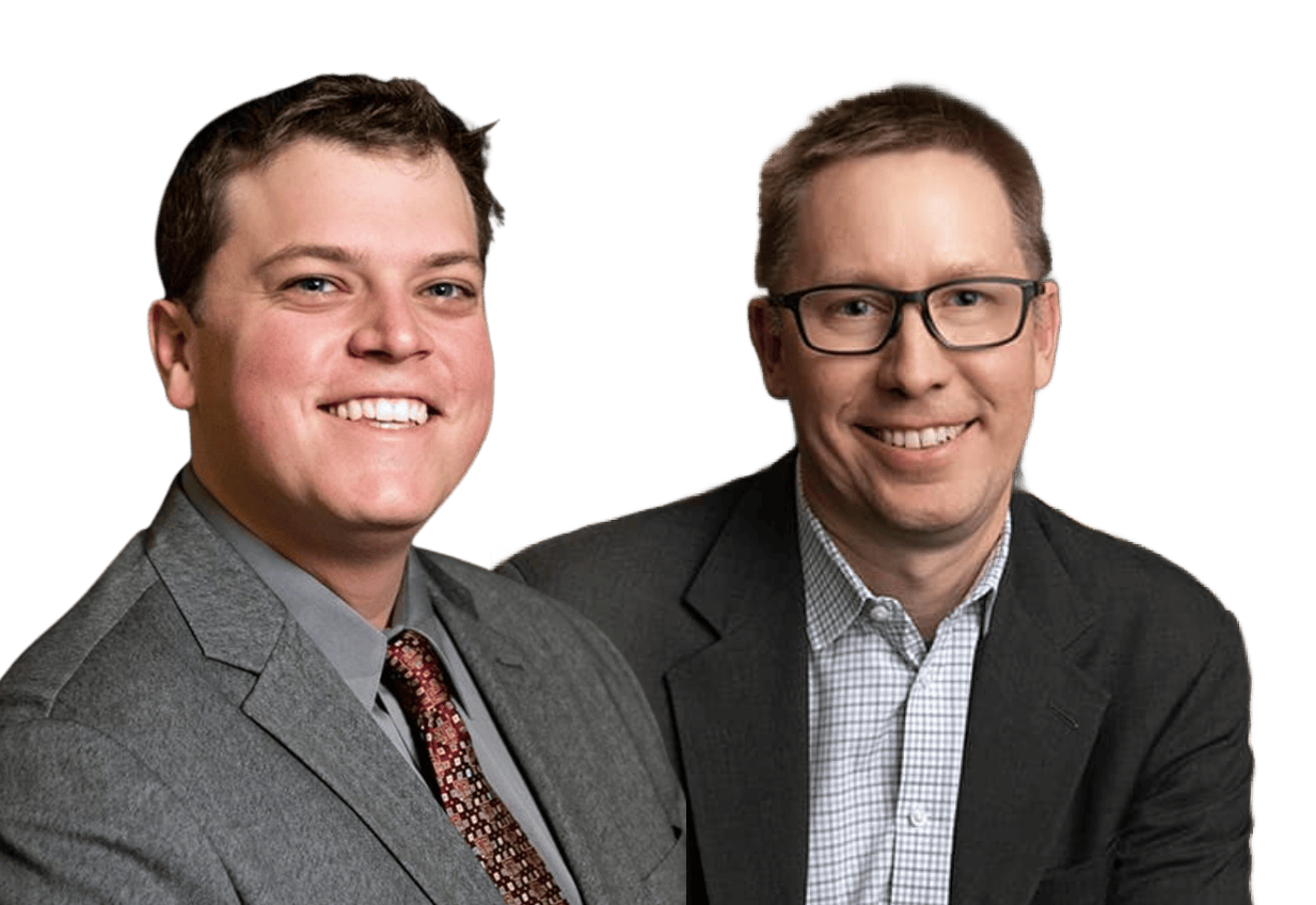 Two men in business attire smiling against a plain white background.